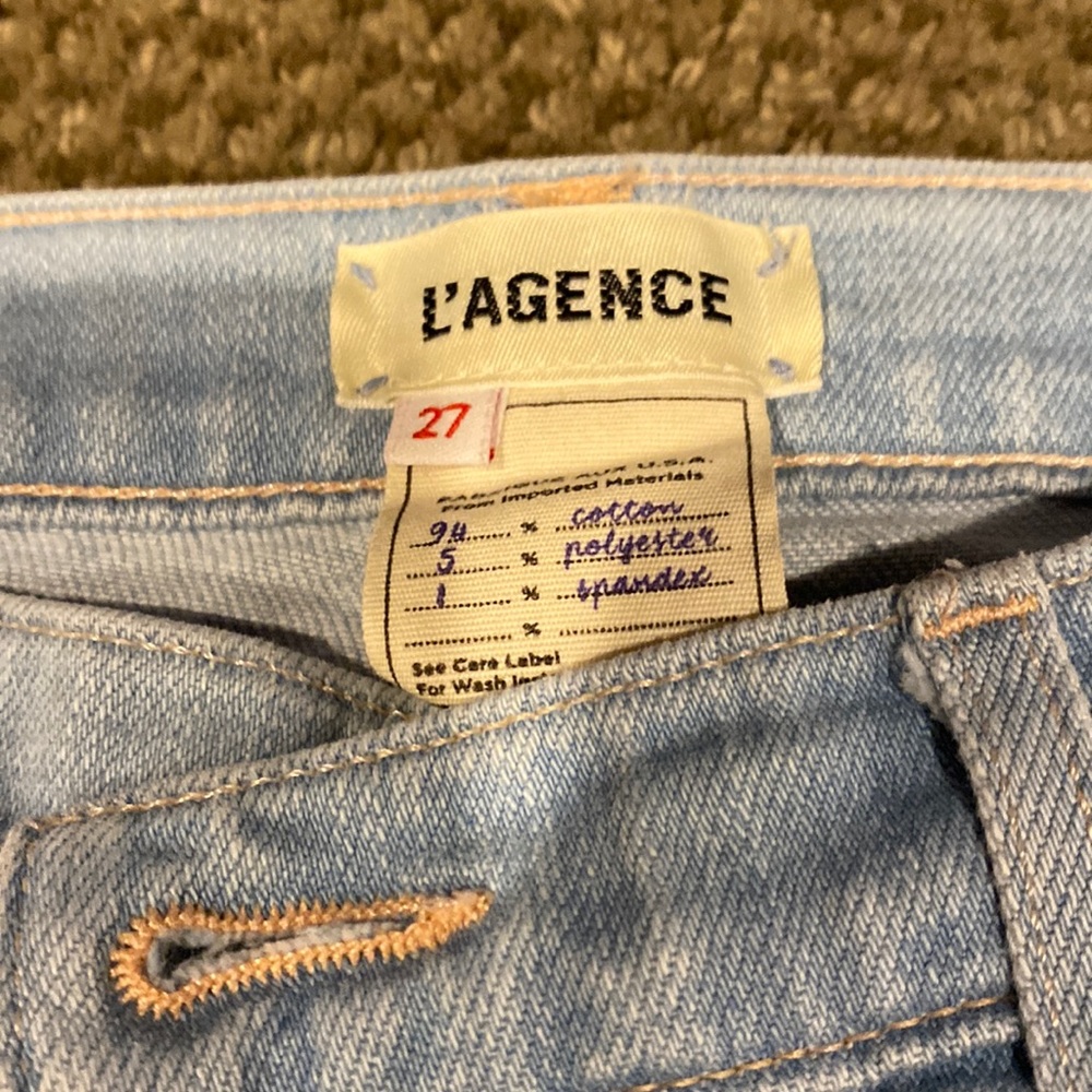 L’Agence cropped light wash denim pant.